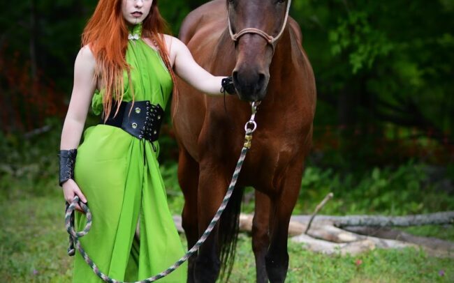 Krystal Kitten with a themed green dress and a horse.