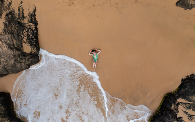 Overhead shot of Krystal Kitten on a beach